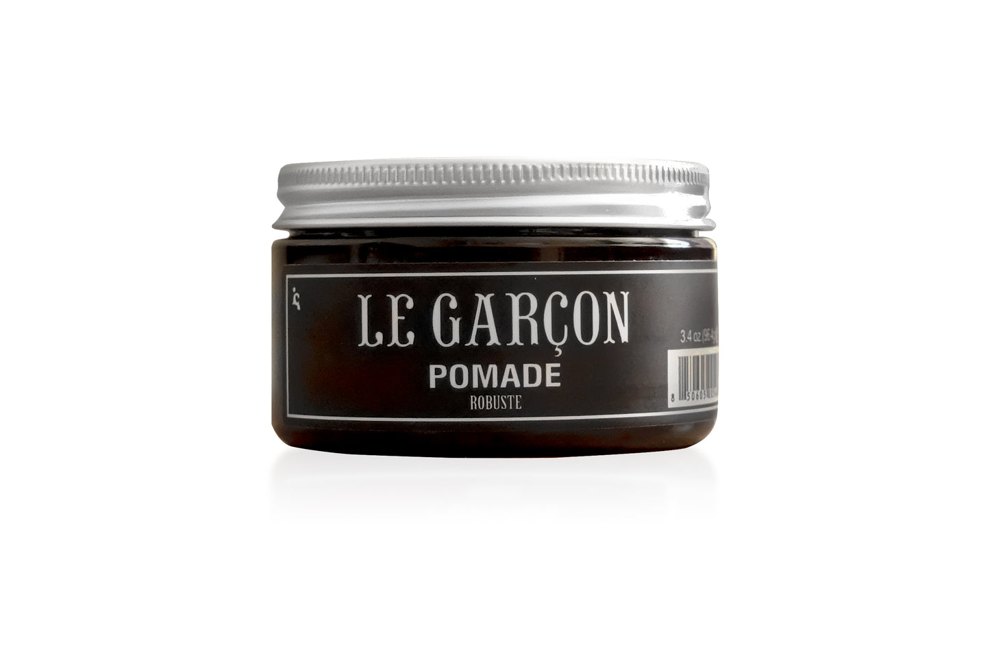A jar of strong hold Le Garcon Robuste Pomade in front of a white background.